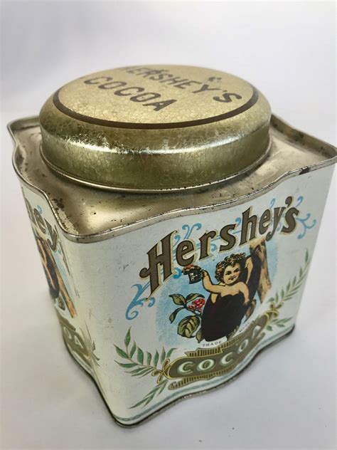 Rowe's Auction Service (RH79L)(Contact) Save This Photo. . Hershey tin collectibles